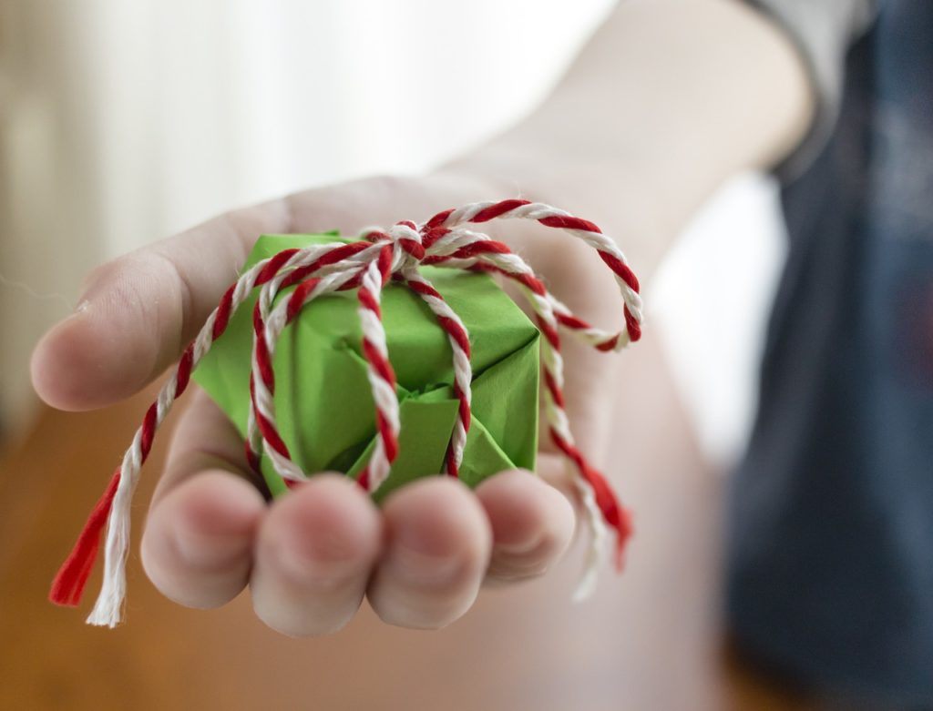 hand giving a christmas gift