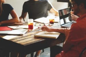 People sitting around at a table. have a great meeting.
