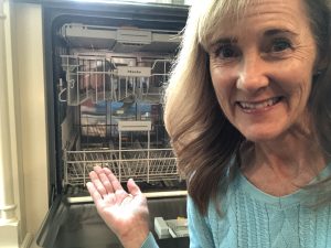 How to Load the Dishwasher
Seana next to an open dishwasher