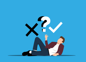 How to Overcome the Dread of Decision-making. Man leaning on his side with an x, a ? and a √