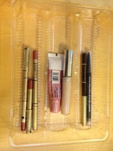 makeup pencils in a reused cookie tray