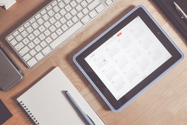 A planner and calendar open on a desk. How to Maximize Planning, Calendars, and Tasks One Day at a Time