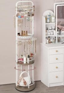 A large, 30-tiered, circular rack that has three shelves and many hooks for storing jewelry and other small items. It swivels on a circular base.