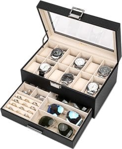 Black leather box. The lid is open showing storage for watches. A drawer is open in the front that holds rings, sunglasses, and cufflinks