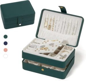 SMall green leather jewelry box with a snap closure