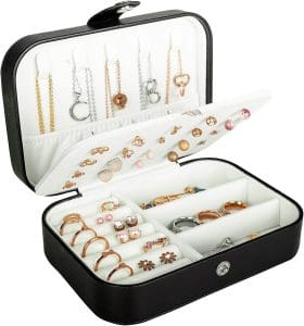 Small, leather box with a snap closure. The inside has storage sections for necklaces, rings, earrings and other small items.