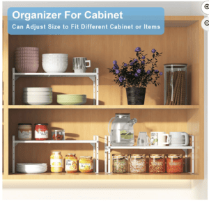 Shelf that are using expandable, white shelving to add more horizontal space. They hold dishes, and jars of food.